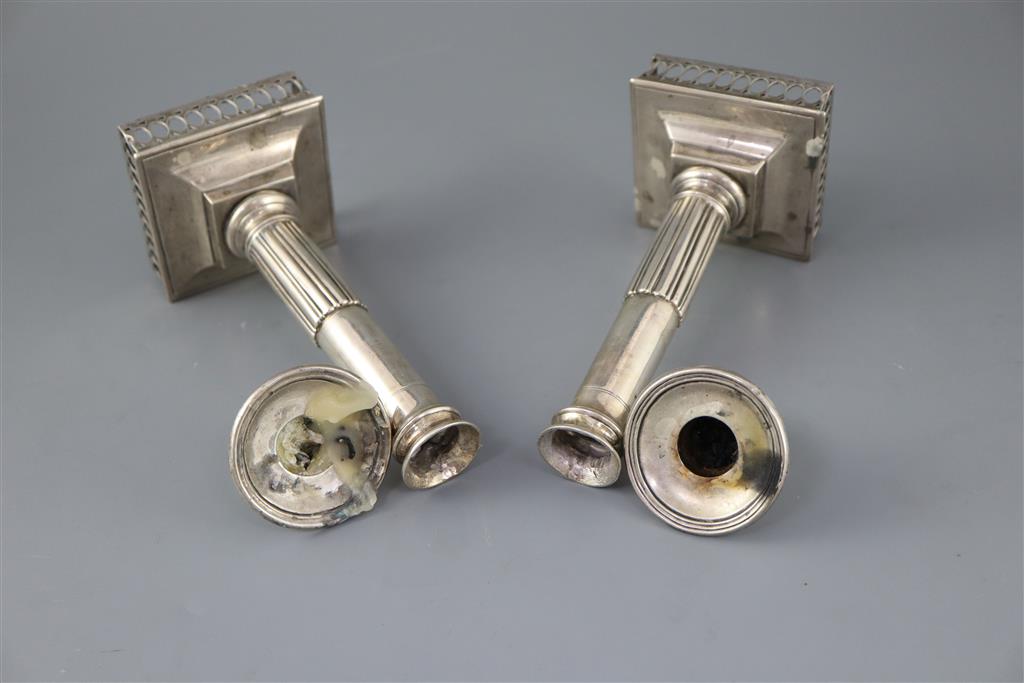 A pair of early 19th century Spanish silver candlesticks, c.1800, ships bases